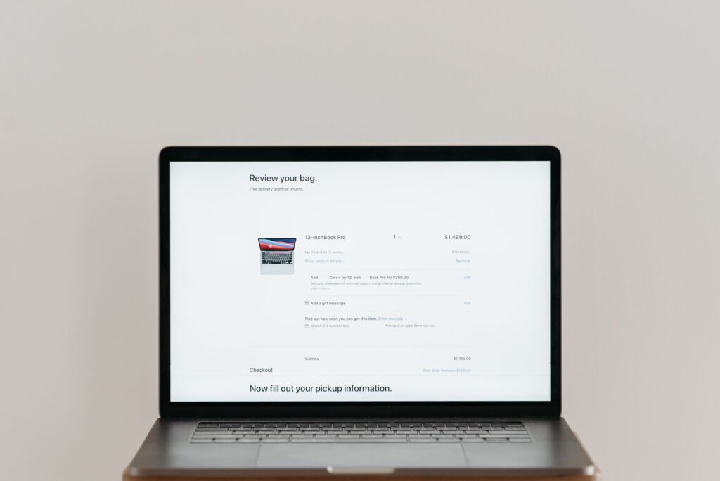 Laptop displaying a clean webpage with trust signals and a clear call to action button
