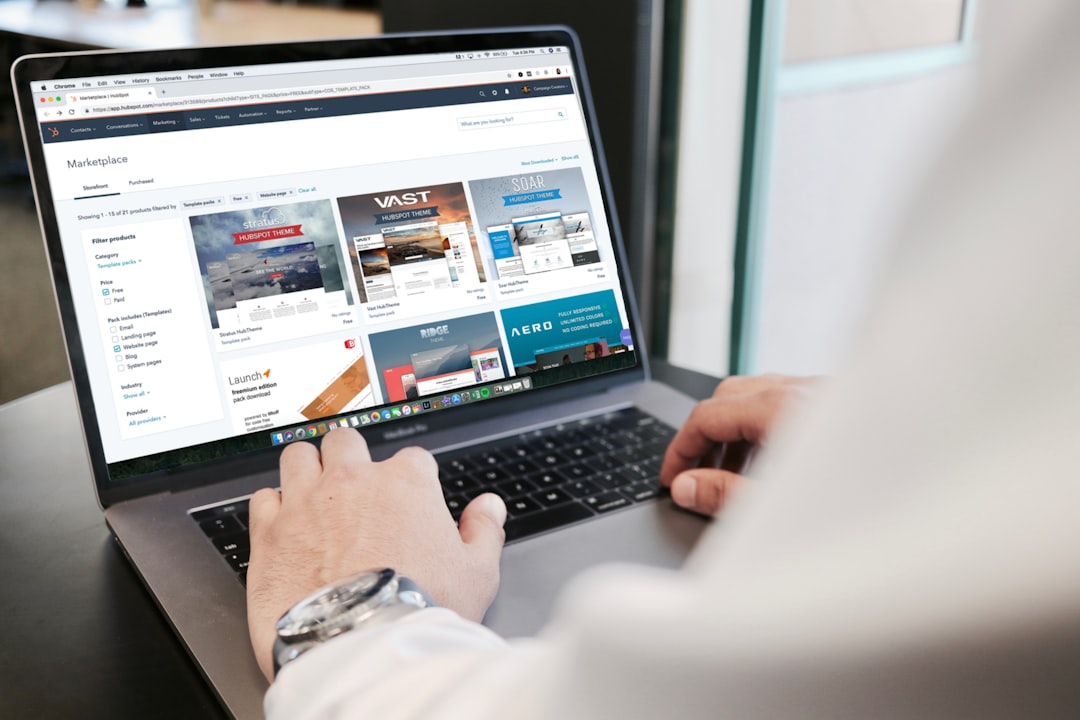 Person reviewing website templates and landing page designs on a MacBook Pro why website is not converting visitors into clients
