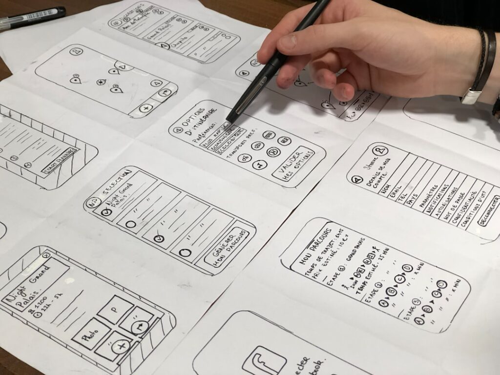 Hand-drawn wireframe sketches of mobile landing page layouts showing structure and conversion elements
